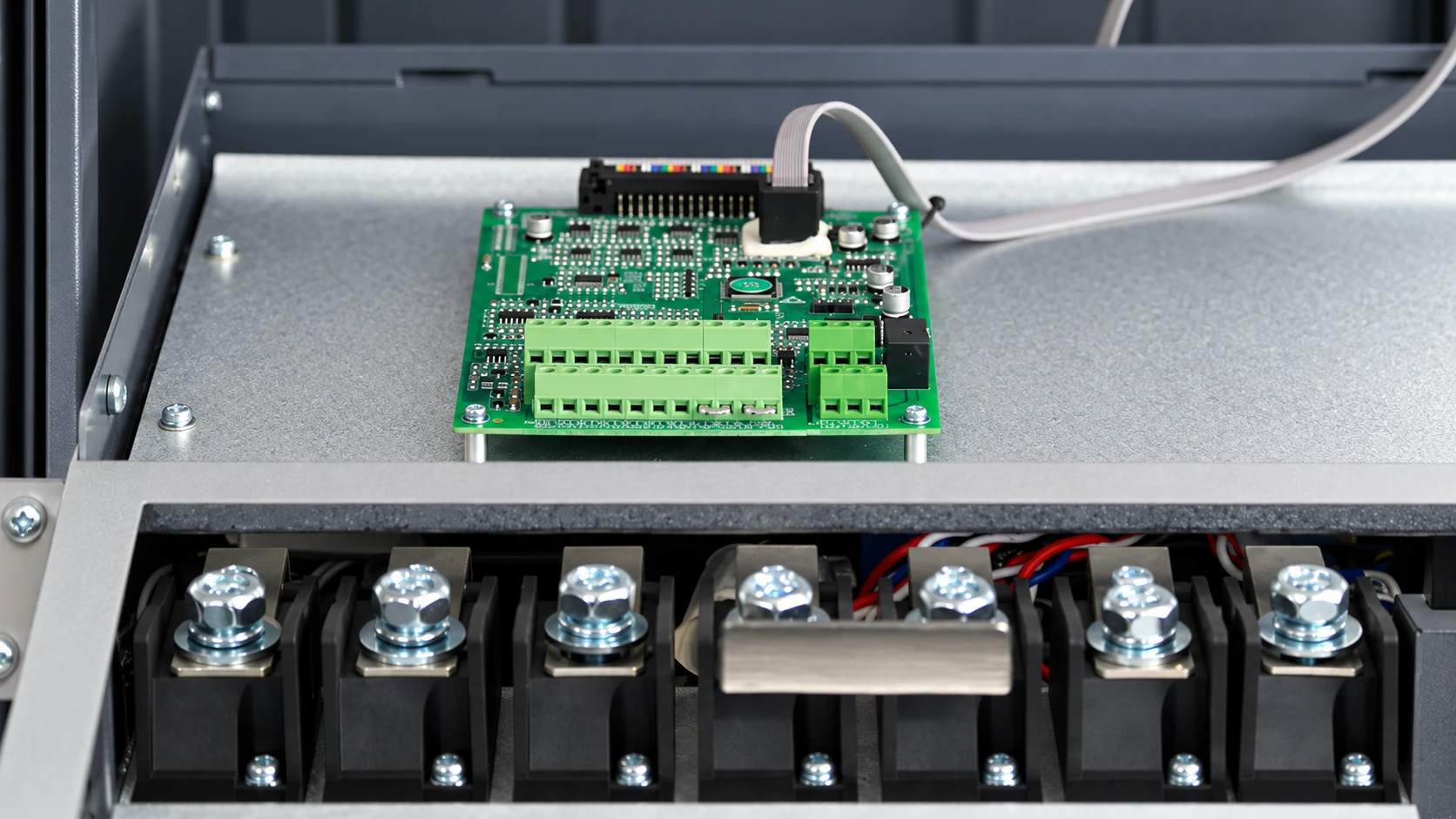 Open NENA 860S inverter enclosure showing a circuit board and power terminals